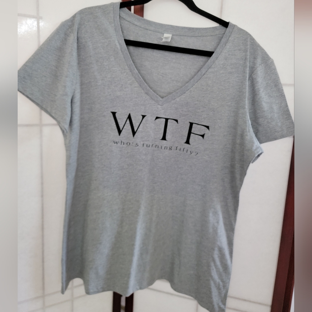 Women's v-neck grey tee-shirt "who's turning fifty"